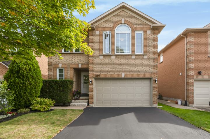 Front exterior, solid brick with attached double garage