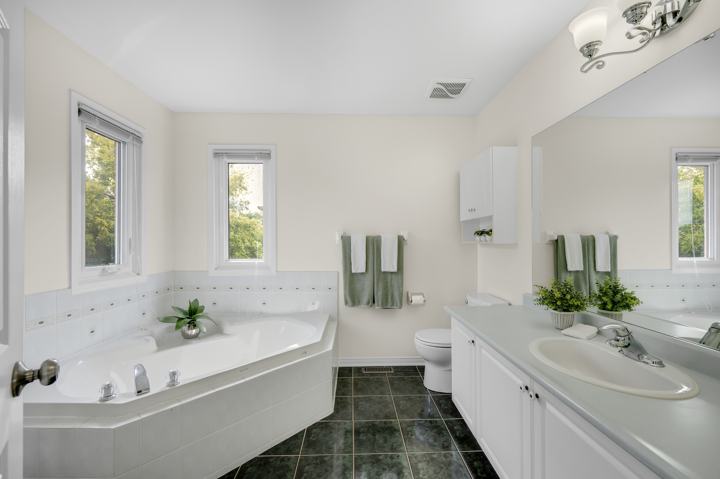 Primary ensuite with corner soaker tub