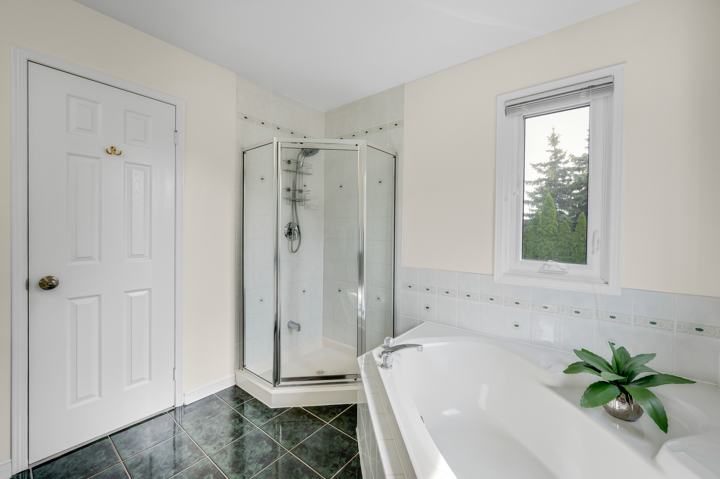 Primary ensuite with separate glass shower